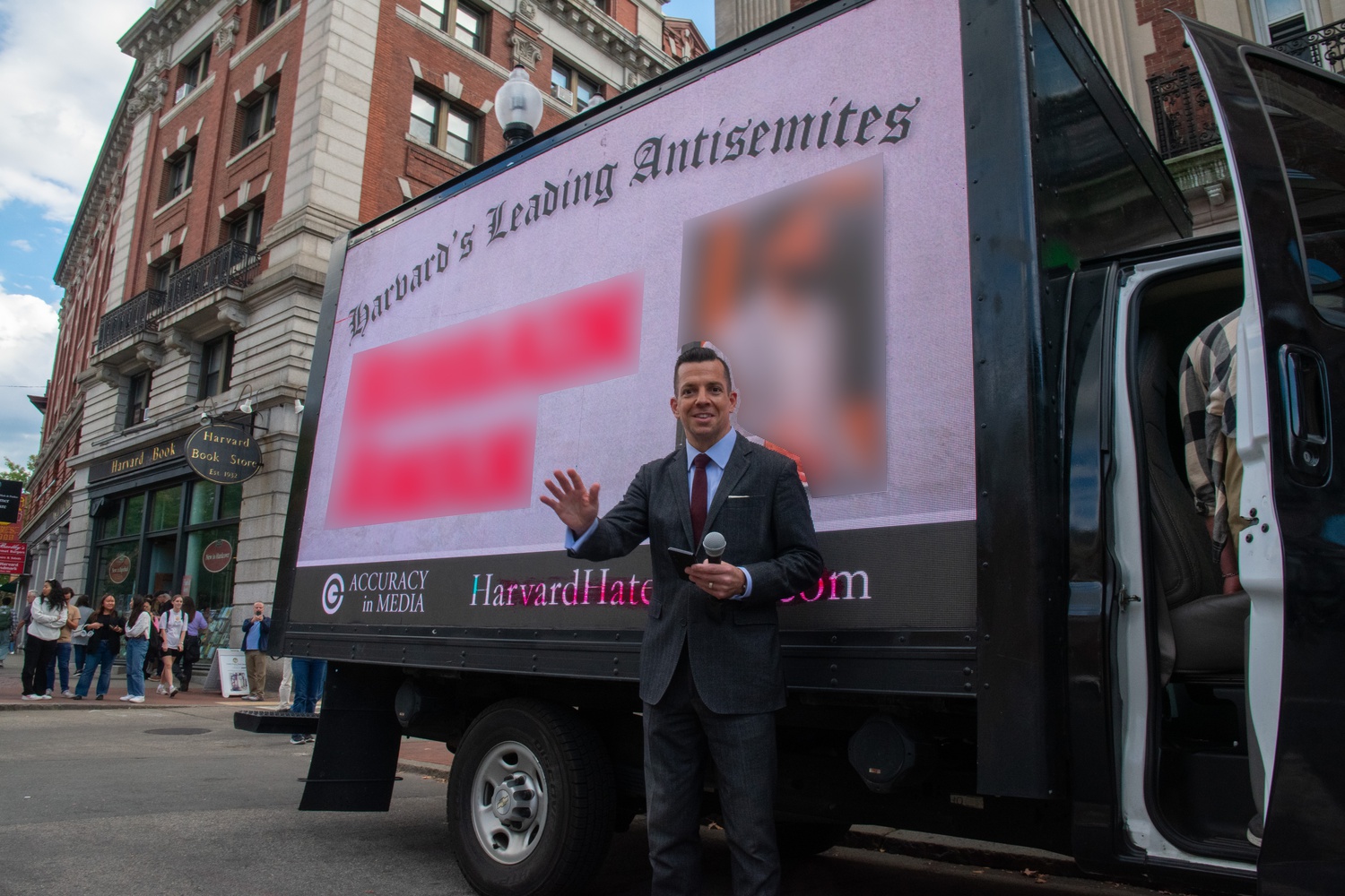 Adam Guillette, the CEO of conservative group Accuracy in Media, stands in front of the truck. The Crimson blurred parts of this photograph to avoid identifying students due to retaliation concerns.