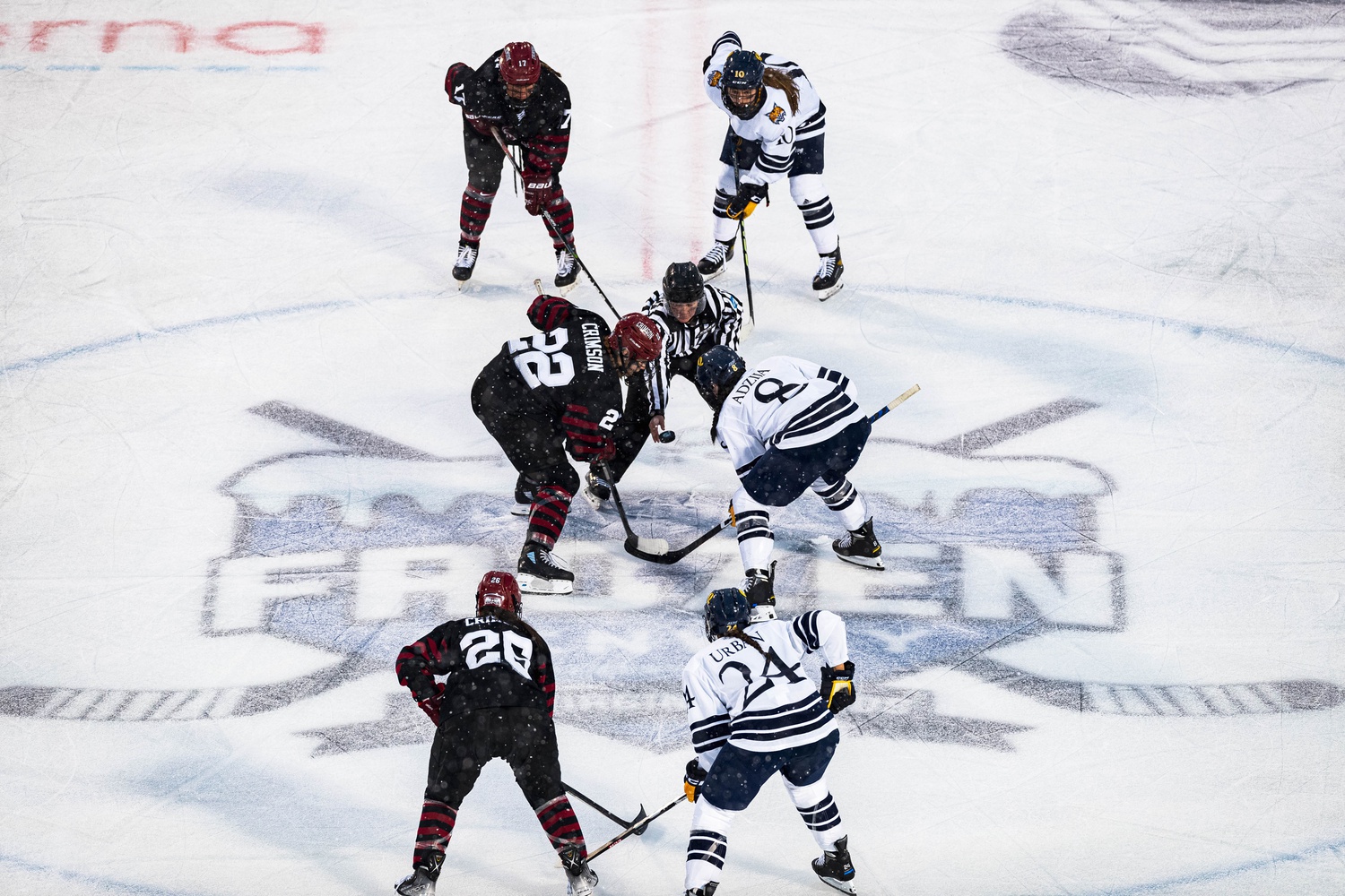 Harvard women's ice hockey faces off with Quinnipiac at the Frozen Fenway game on January 6, 2023.